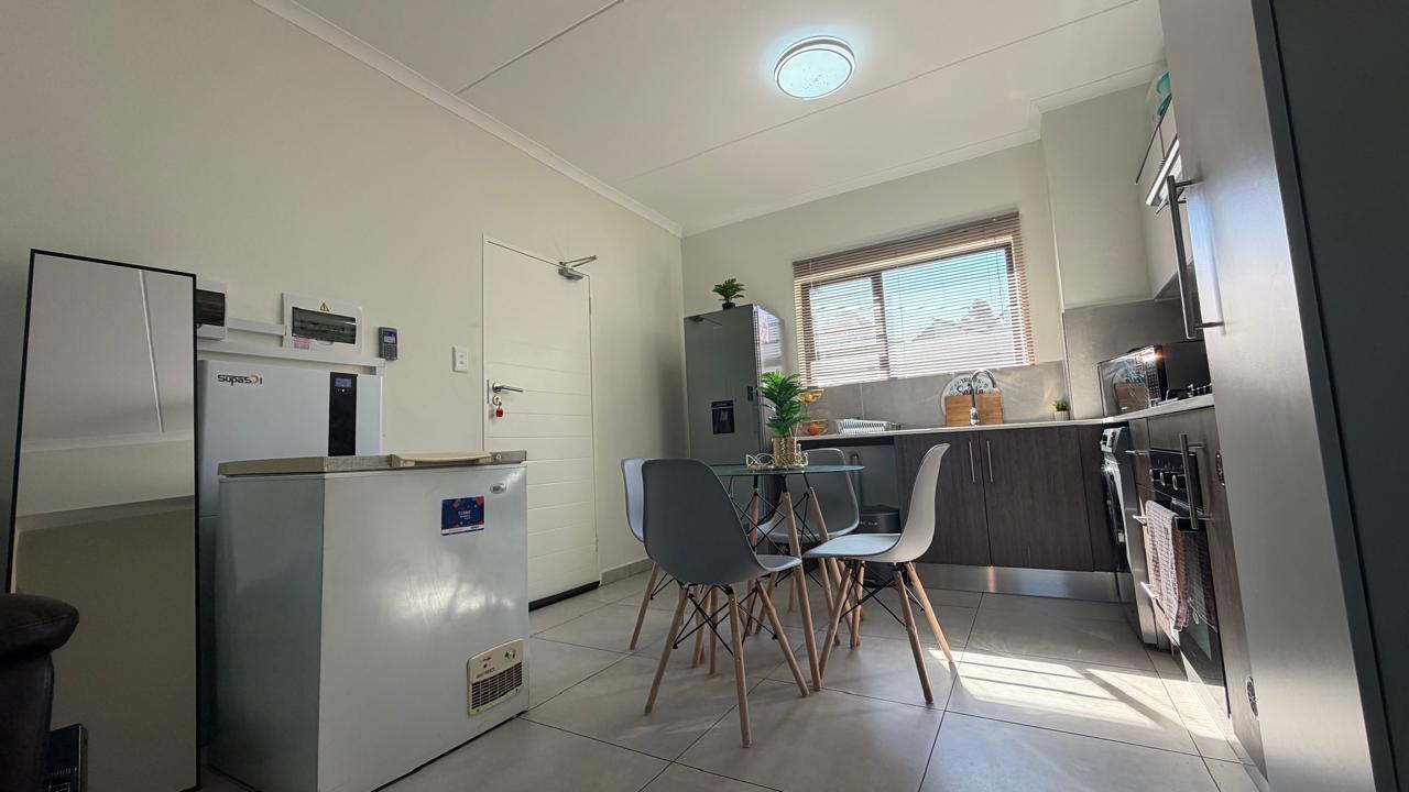 Dining — Light-filled dining area with generous storage