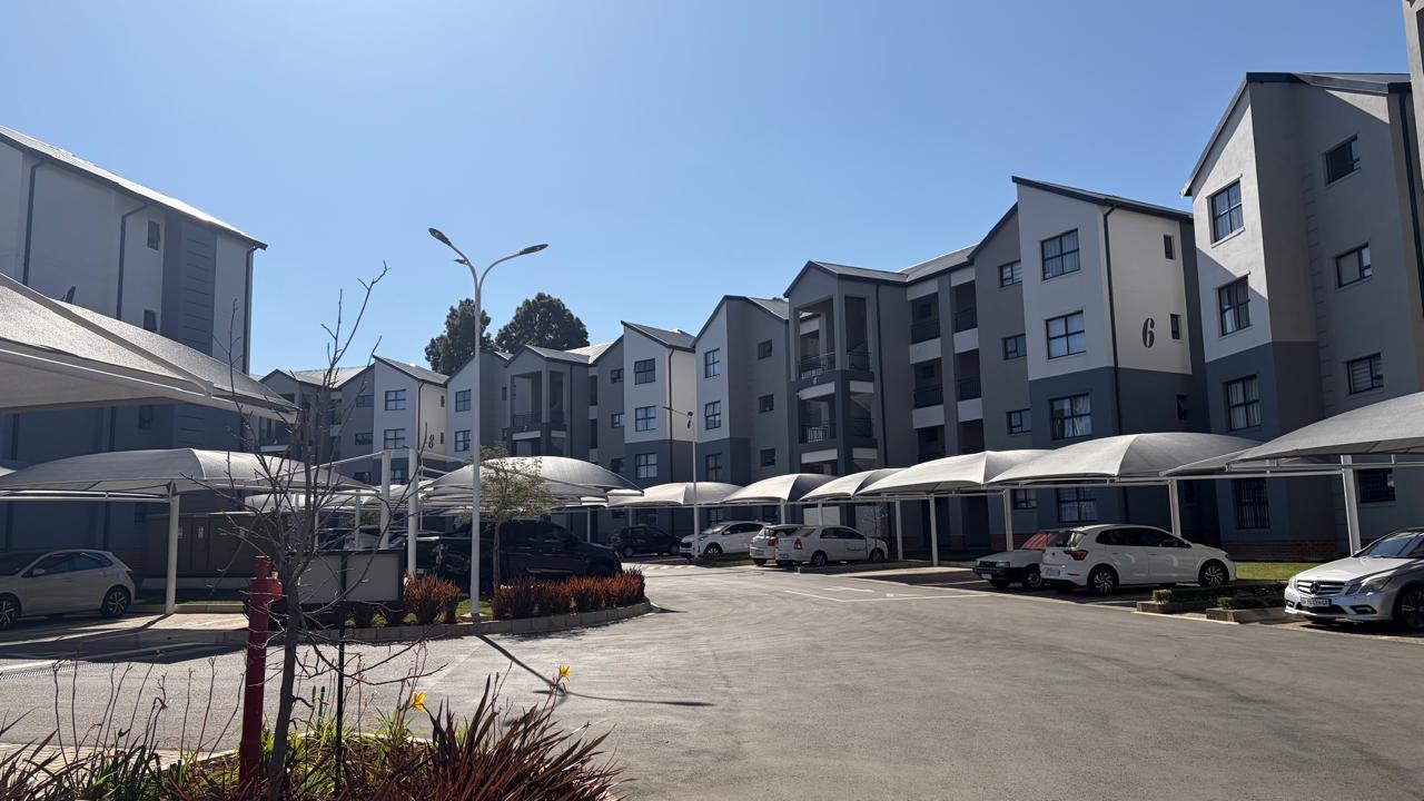 The Estate — Landscaped, secure complex with covered parking bays