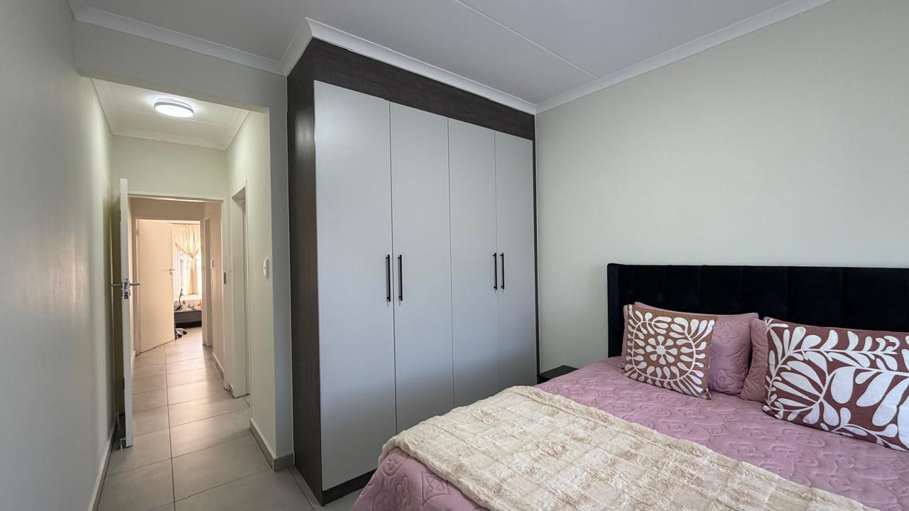 Main Bedroom — Built-in wardrobes and soft natural light